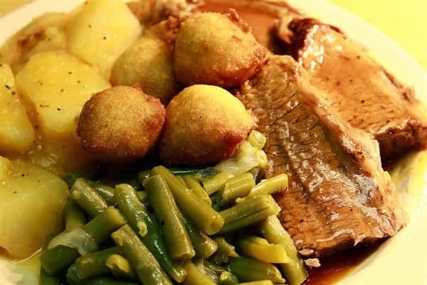 brisket with vegetables and hush puppies