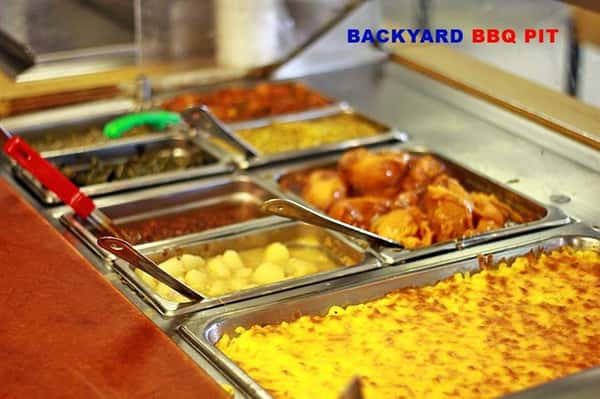 buffet style metal containers with bbq food