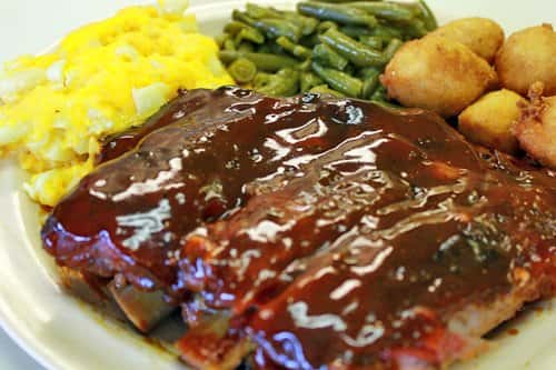 bbq ribs with a side of vegetables