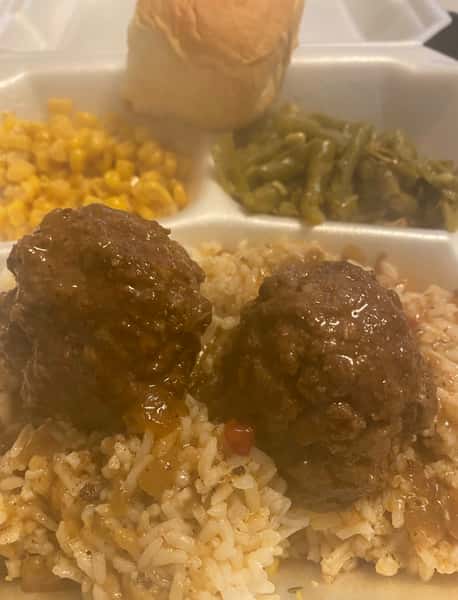 Meatballs and rice with sides