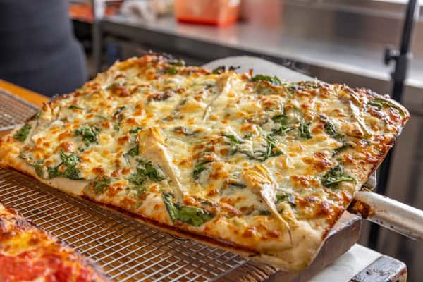 pizza fresh out the oven, on a baking pan