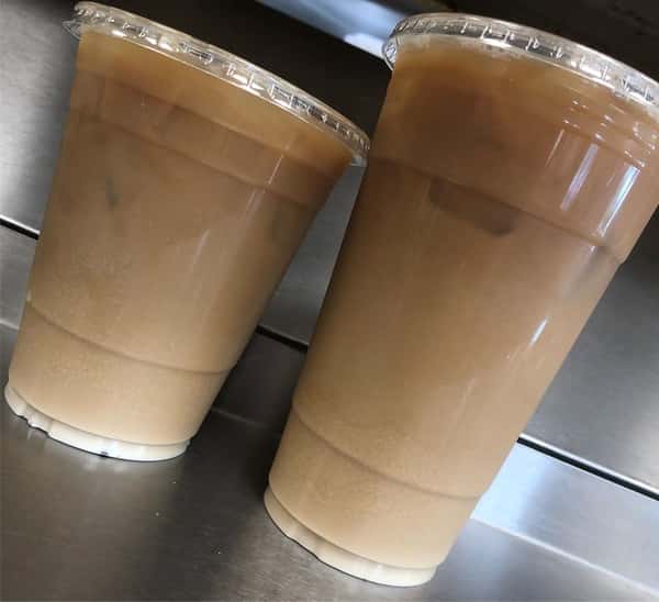 two iced coffees on a counter top