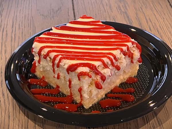 Mexican tres leches cake drizzled with raspberry purée.