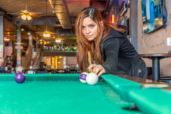 woman shooting pool