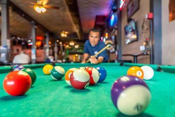 man shooting pool