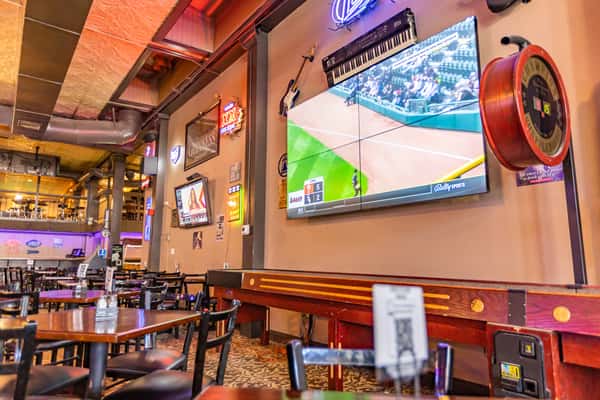 large tv mounted on wall