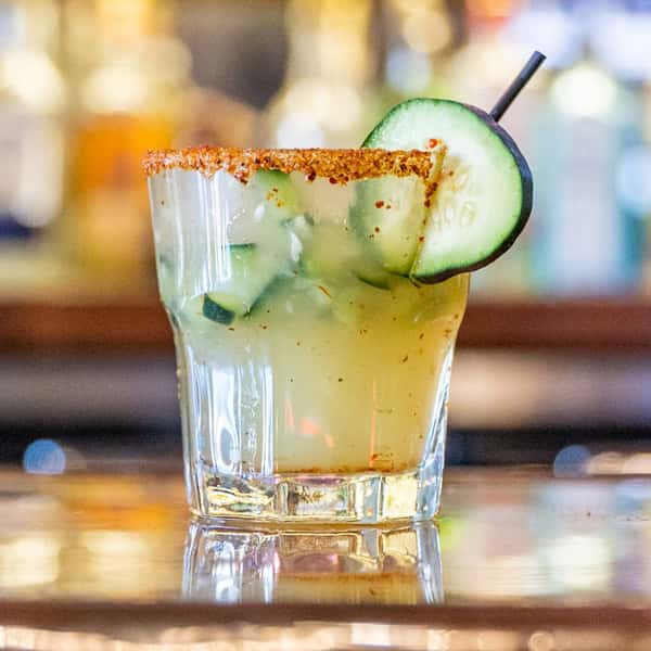 cocktail with cucumber garnish