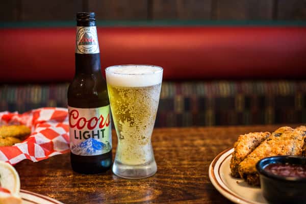 beer in glass with bottle