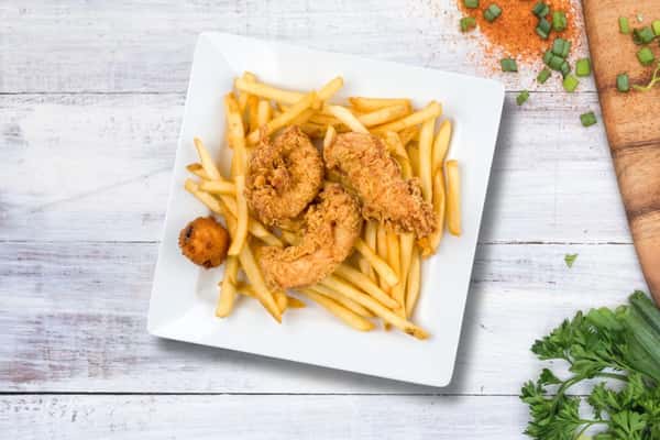 Fried shrimp platter served with crispy French fries and hush puppies, classic seafood basket