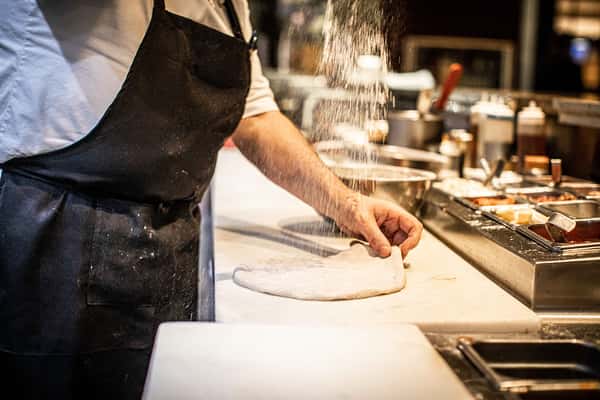 chef flouring dough