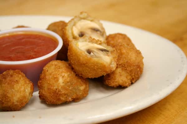 Stuffed mushroom appetizer with red marinara dipping sauce