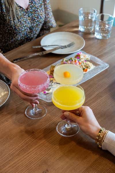 Guests toasting with cocktails