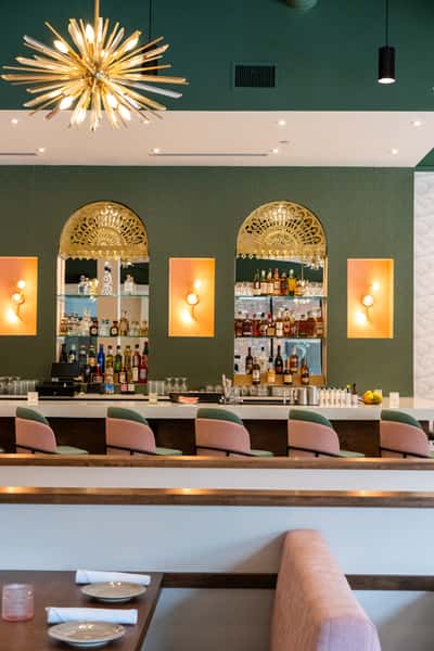 Elegant marble bar with pink plush seating