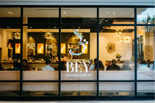 Floor to ceiling windows with the BEY logo