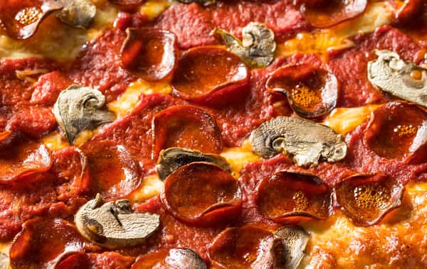 Pepperoni and mushroom pizza up close