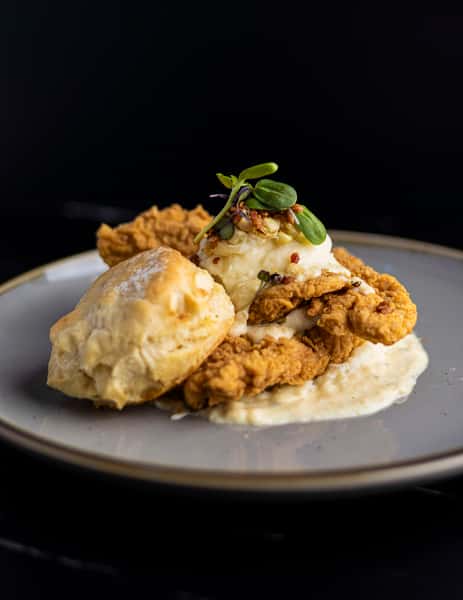 Fried chicken with a biscuit and gravy