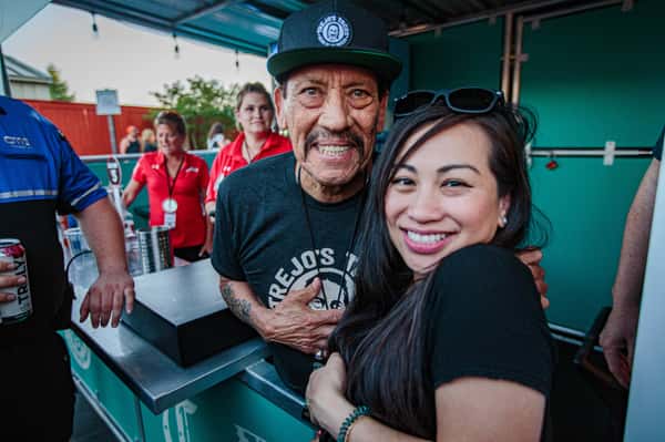 Danny Trejo with a fan
