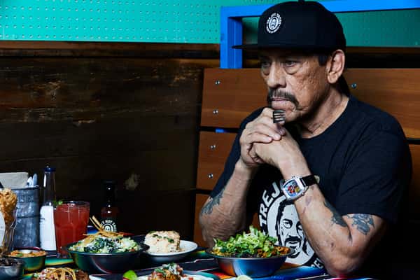 Danny Trejo preying before meal