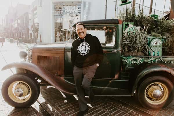 Danny Trejo in front of truck