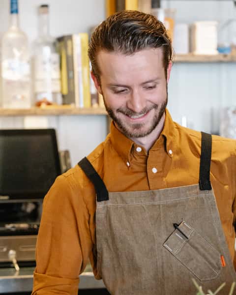 A happy man with an apron