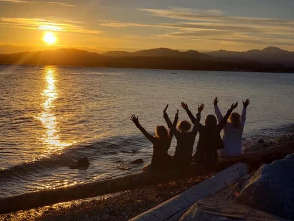 people looking at sunset
