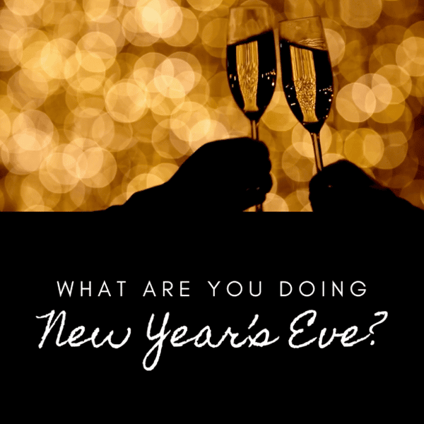 silhouette of people clinking champagne glasses