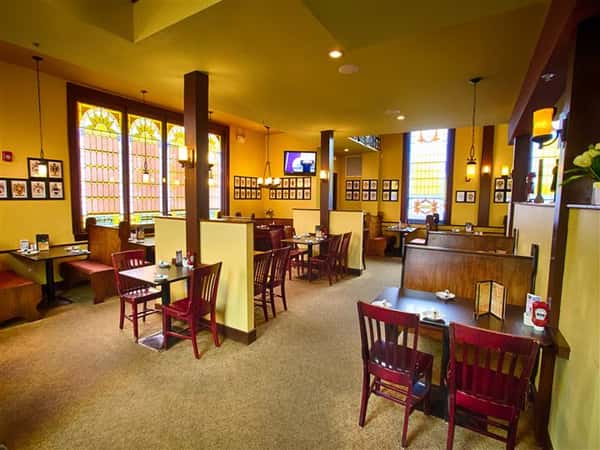 tables and chairs inside restaurant