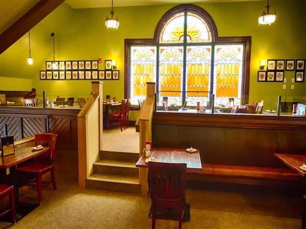 tables and chairs inside restaurant