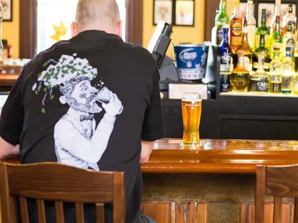 male sitting at bar