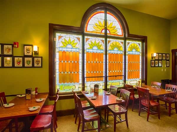 tables and chairs inside restaurant