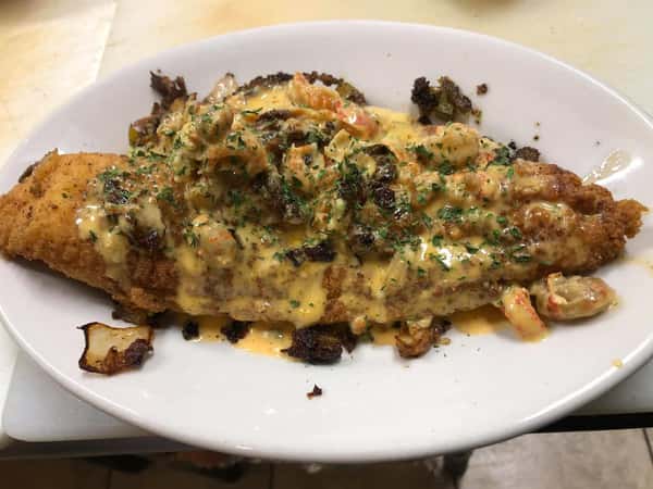 fried fish topped with cajun sauce