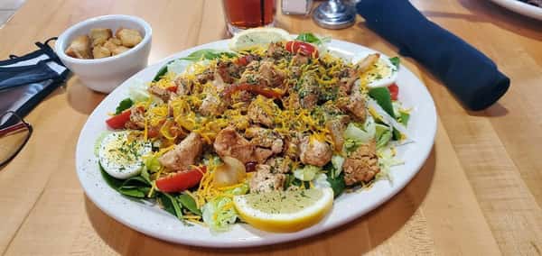 salad topped with chicken