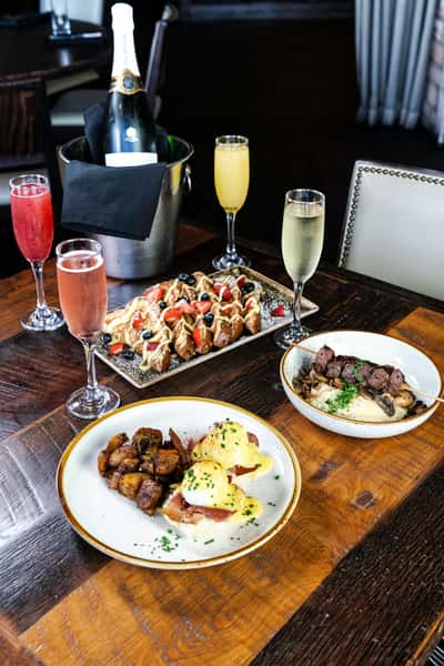 spread of menu items and beverages from The Honeysuckle