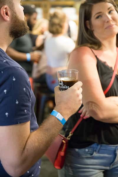 Person with a beer in the hand