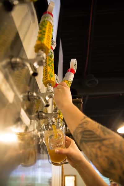 Person picking up beer