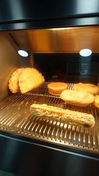 Fish and chip shop food cooking under heat lamps at Blue Bay in Bridgeton.