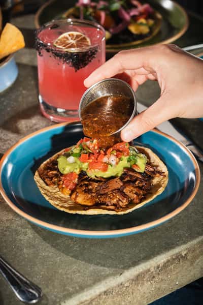 Tacos with salsa and drinks