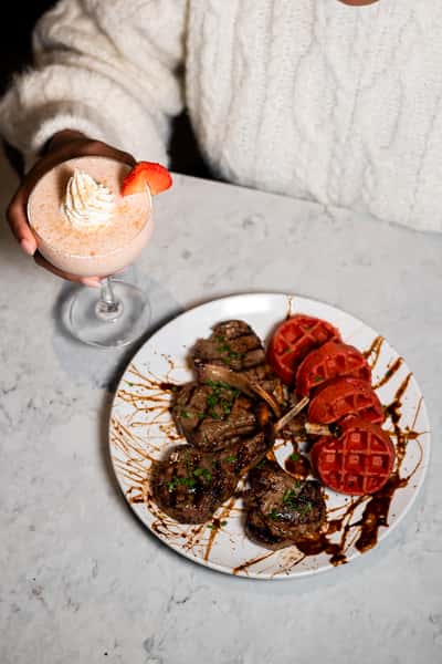pink cocktail and food