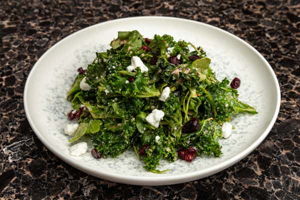 Salad with cheese and pomegranate seeds