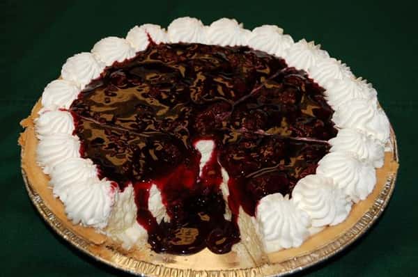 Pie with cherry and chocolate sauce.