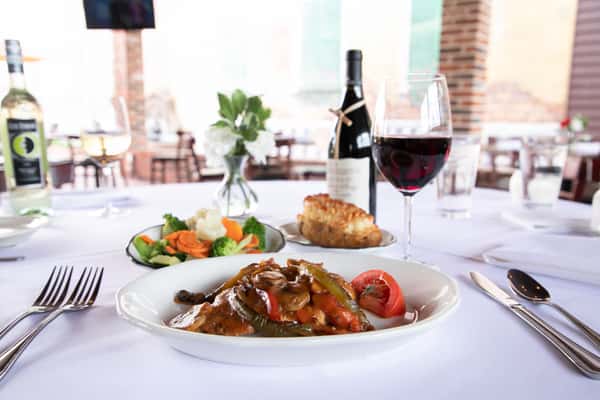 catered meal with red wine