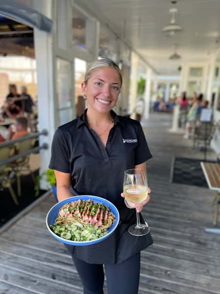 waitress holding food and drink