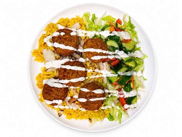 Falafel platter with seasoned yellow rice, grilled onions, fresh cucumber salad, lettuce, peppers, and creamy white sauce