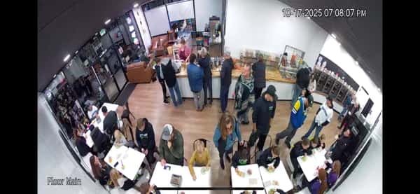 1. Frozen yogurt shop interior packed with customers at self-serve topping bar and tables – lively dessert café atmosphere with families enjoying froyo and sweets.