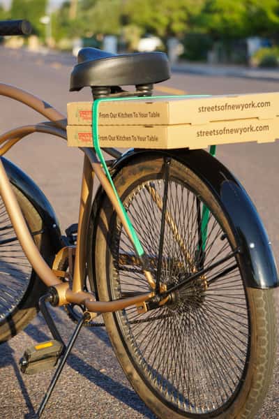 Bike with pizza boxes strapped to the back