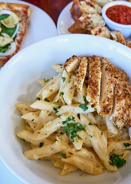 penne pasta with alfredo sauce and breaded chicken