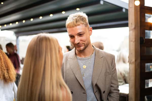blonde boy in convo with girl