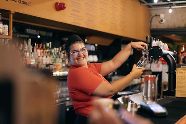 bartender smiling with cocktail