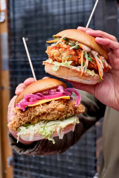 CHICK N SOURS BURGERS IN HAND