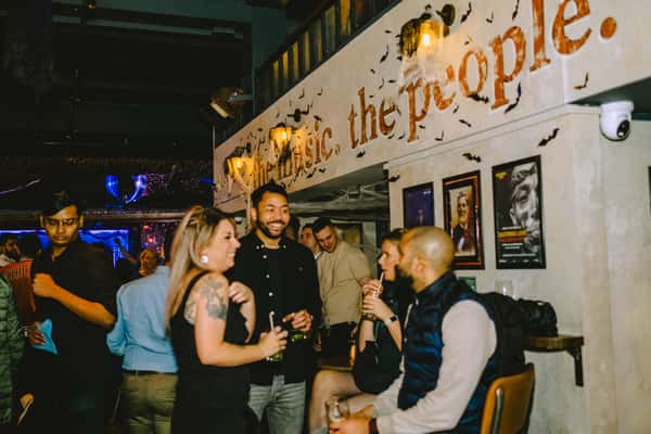 people mingling near bar